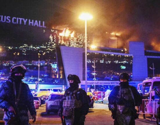 Security personnel guarding Crocus Concert Hall in Moscow after the terror attack.